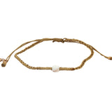 Bracelet doré cordon fin doré avec perle en os