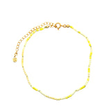 Chaine de cheville dorée en perles jaunes