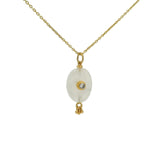 Gold necklace with unset stone, tassels and zircon