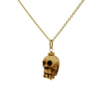 Collier doré tête de mort beige taillée dans de l'os 42 cm