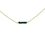 Gold choker with small natural stones