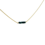 Gold choker with small natural stones