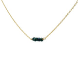 Gold choker with small natural stones