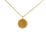 Collier doré médaille oeil d'horus et zircons blancs 42 cm