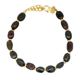 Bracelet doré grenat et disques dorés