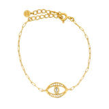 Golden bracelet with lucky eye, stone and zircons