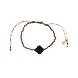 Bracelet cordon doré petit trèfle en pierre facettée