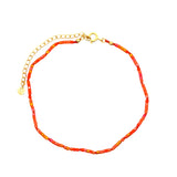 Chaine de cheville dorée et perles oranges
