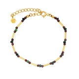 Bracelet doré petit tubes avec rubis zoisite et grenat