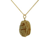 Collier doré gros scarabée bois beige 42 cm