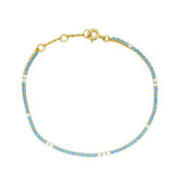 Bracelet doré Tennis en zircons blancs et bleus