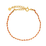 Bracelet doré perles dorées facettées et noeud orange