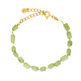 Bracelet doré peridots rectangles sur cordon