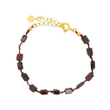 Golden bracelet with rectangular stones on cord