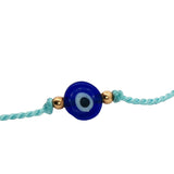 Bracelet doré cordon turquoise avec oeil rond bleu foncé