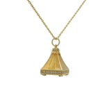 Gold necklace with bell pendant, zircons and stone