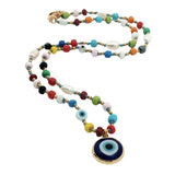 Collier perles de culture, fantaisies et oeil bleu 42cm