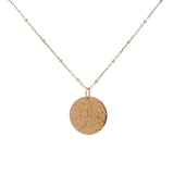 Gold necklace with medal engraved with leaves and "LUCKY YOU"