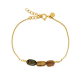 Gold bracelet and stone trilogy