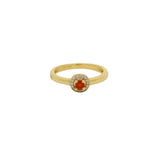 Bague dorée petit solitaire rond pierre et zircons