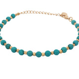 Bracelet with golden beads and faceted stones