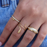 Fine gold ring with zircons and tassel