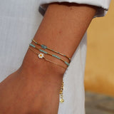 Bracelet doré petite fleur marguerite