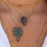 Gold necklace and natural stone fish