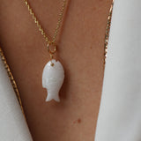 Gold necklace and natural stone fish