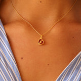 Gold broken heart and stone necklace