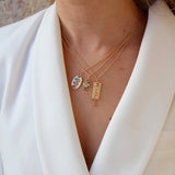 Collier doré et pendentif trilogie pierres 42 cm