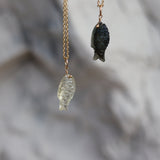 Gold necklace and natural stone fish