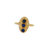 Hammered oval gold ring and trio of stones