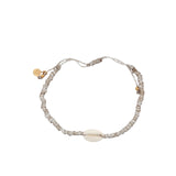 Bracelet doré cordon beige avec cauri naturel
