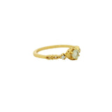 Openwork gold ring with stone and zircons
