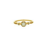 Openwork gold ring with stone and zircons
