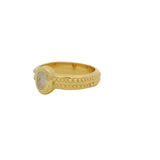 Golden ring with oval stone and wide ring