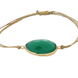 Bracelet sur cordon doré onyx verte ovale facettée