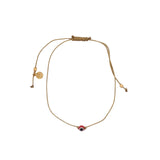 Bracelet doré fil fin doré avec oeil rouge