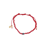 Bracelet doré sur cordon rouge avec petit oeil noir