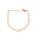 Bracelet doré avec perles en os