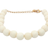 Bracelet doré avec perles en os