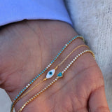 Bracelet doré Tennis en zircons blancs et bleus