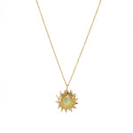 Collier doré pendentif soleil et pierre