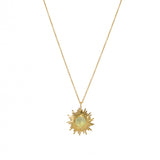 Collier doré pendentif soleil et pierre