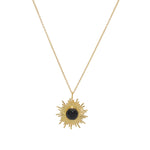 Collier doré pendentif soleil et pierre