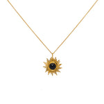Collier doré pendentif soleil et pierre