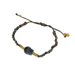 Bracelet cordon noir et doré tête de mort