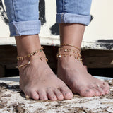Bracelet de cheville doré et pampilles pierres