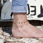 Bracelet de cheville doré et pampilles pierres